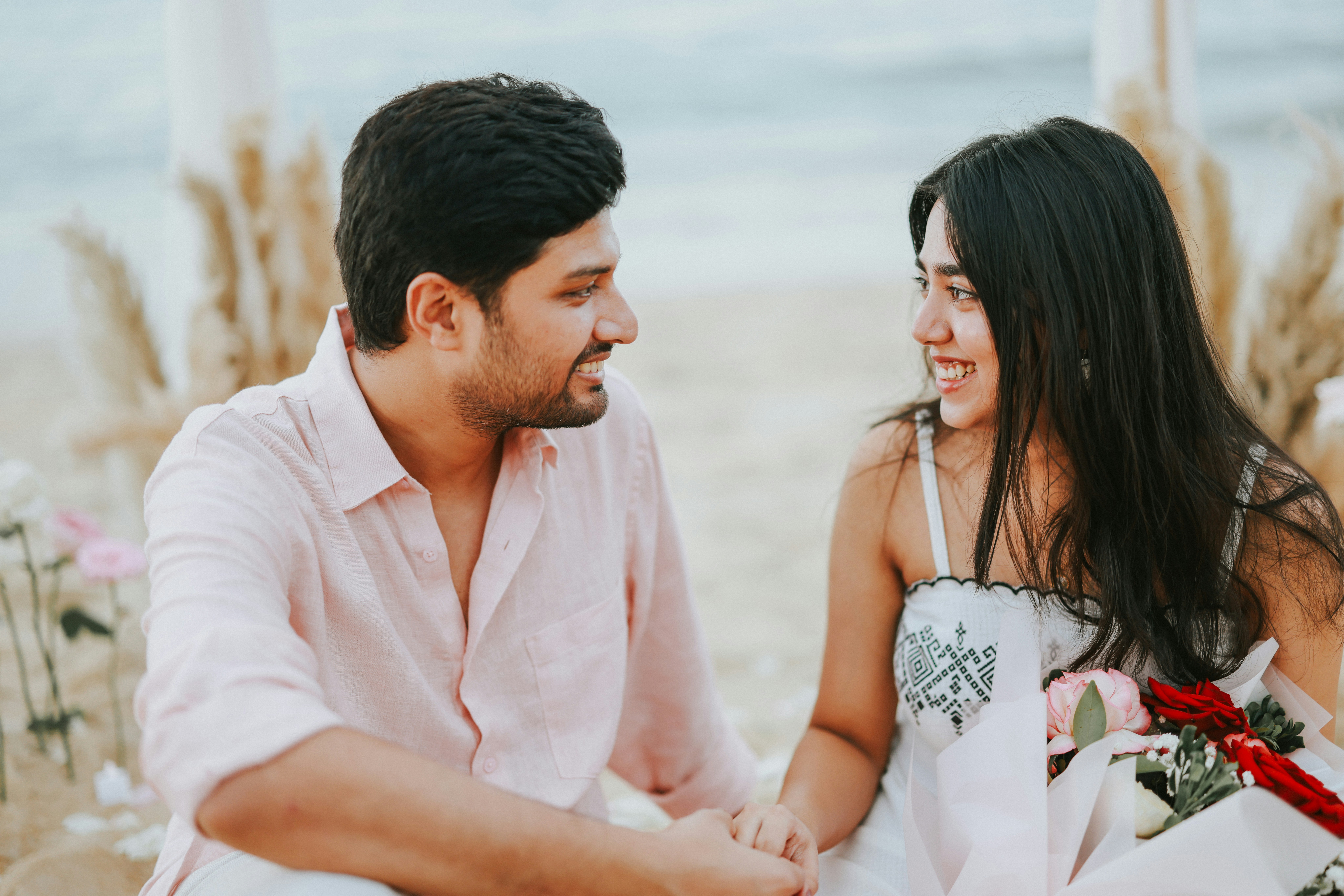 man and woman with child sitting beside table