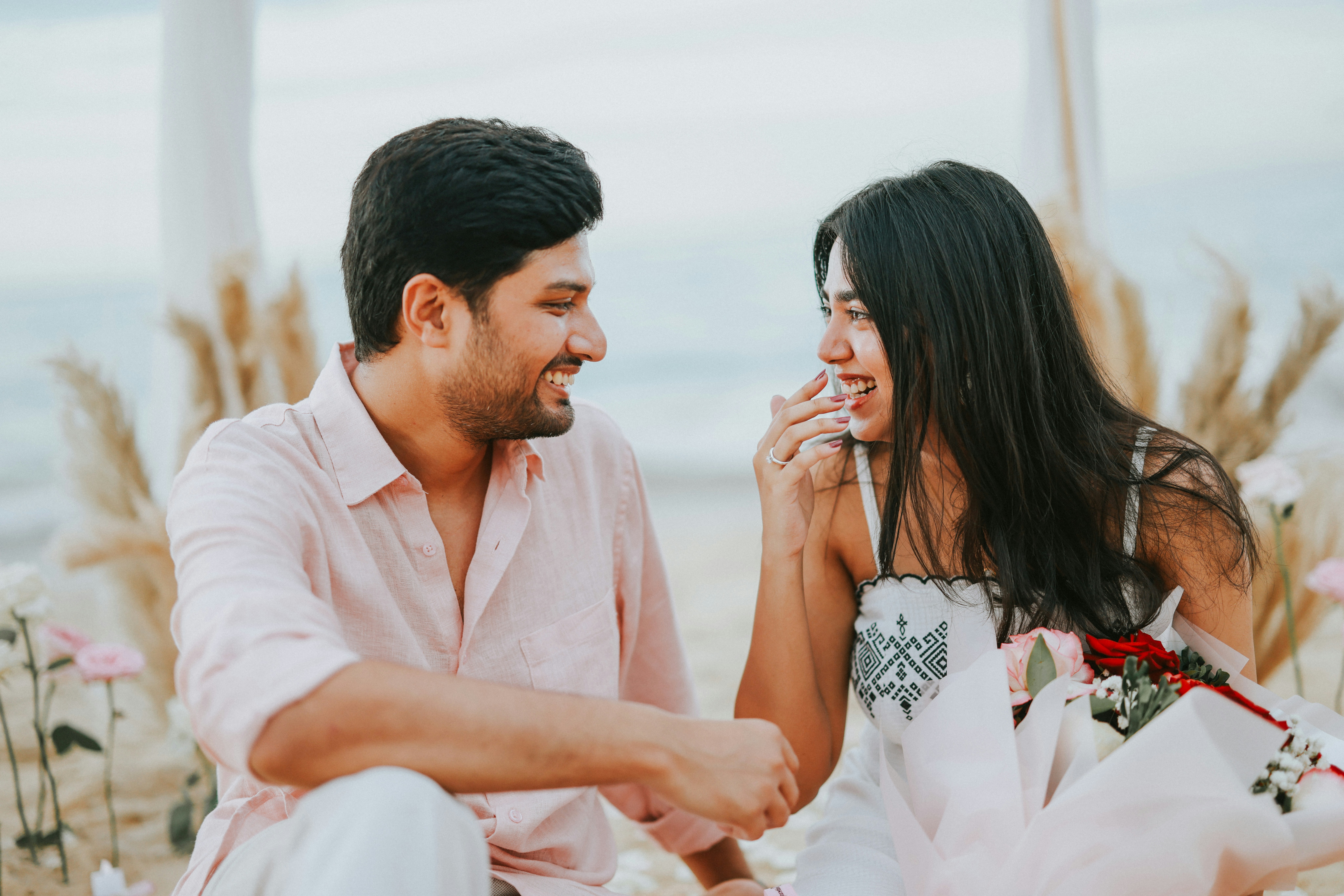 Couple laughing together on beach