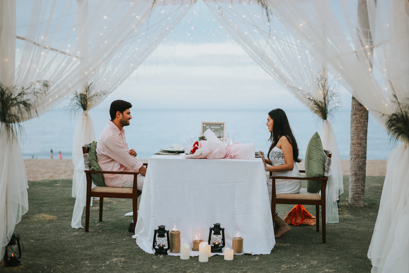 Couple at a romantic beachfront dinner