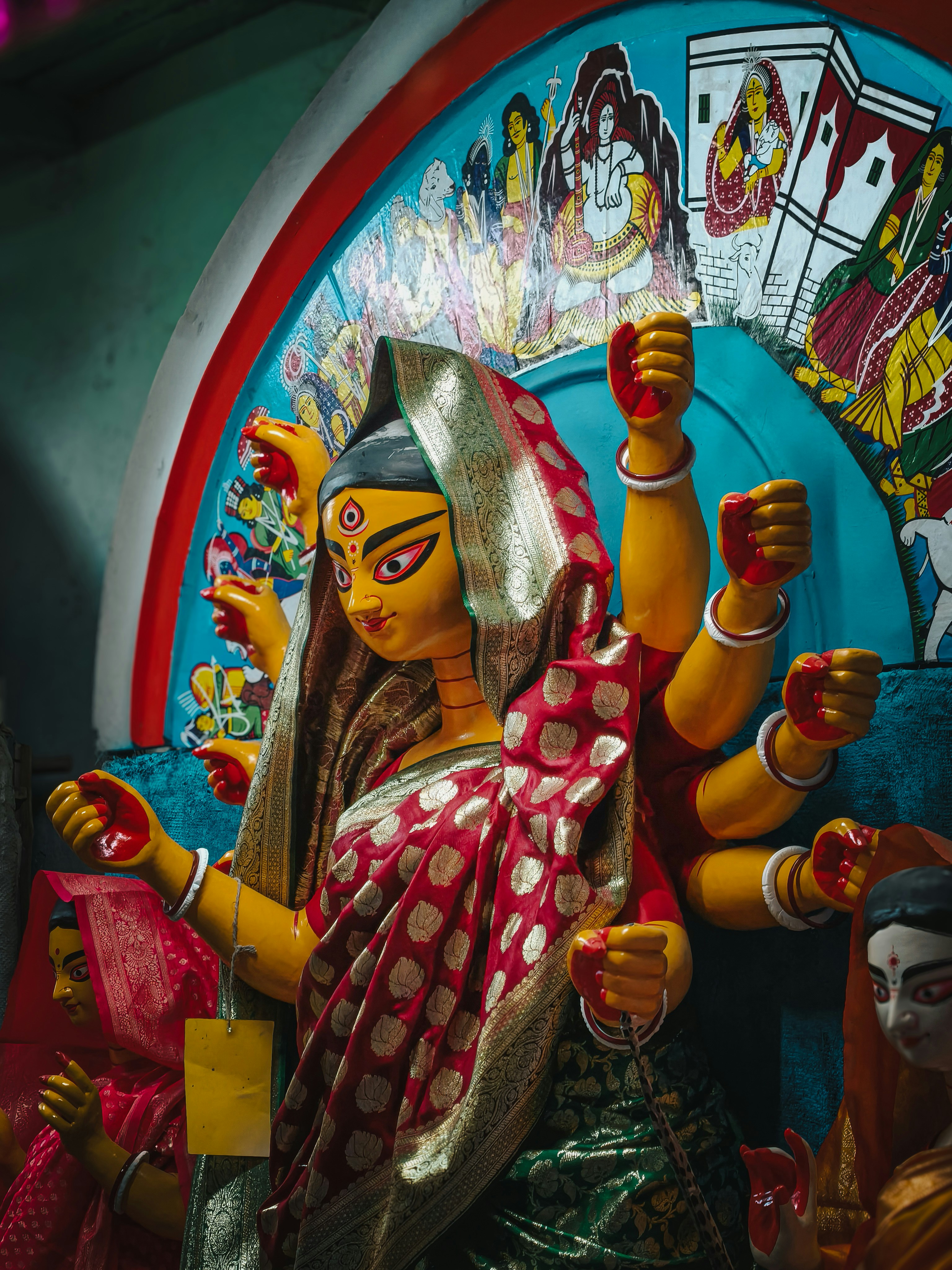 A colorful statue of a multi-armed goddess