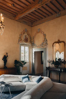 Elegant living room with ornate details and plush sofa