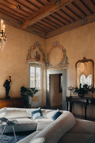 Elegant living room with ornate details and plush sofa