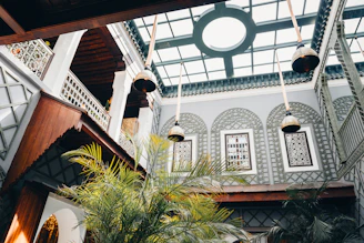 Interior courtyard with plants and hanging lamps