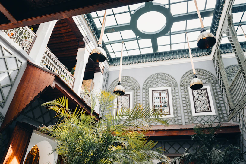 Interior courtyard with plants and hanging lamps
