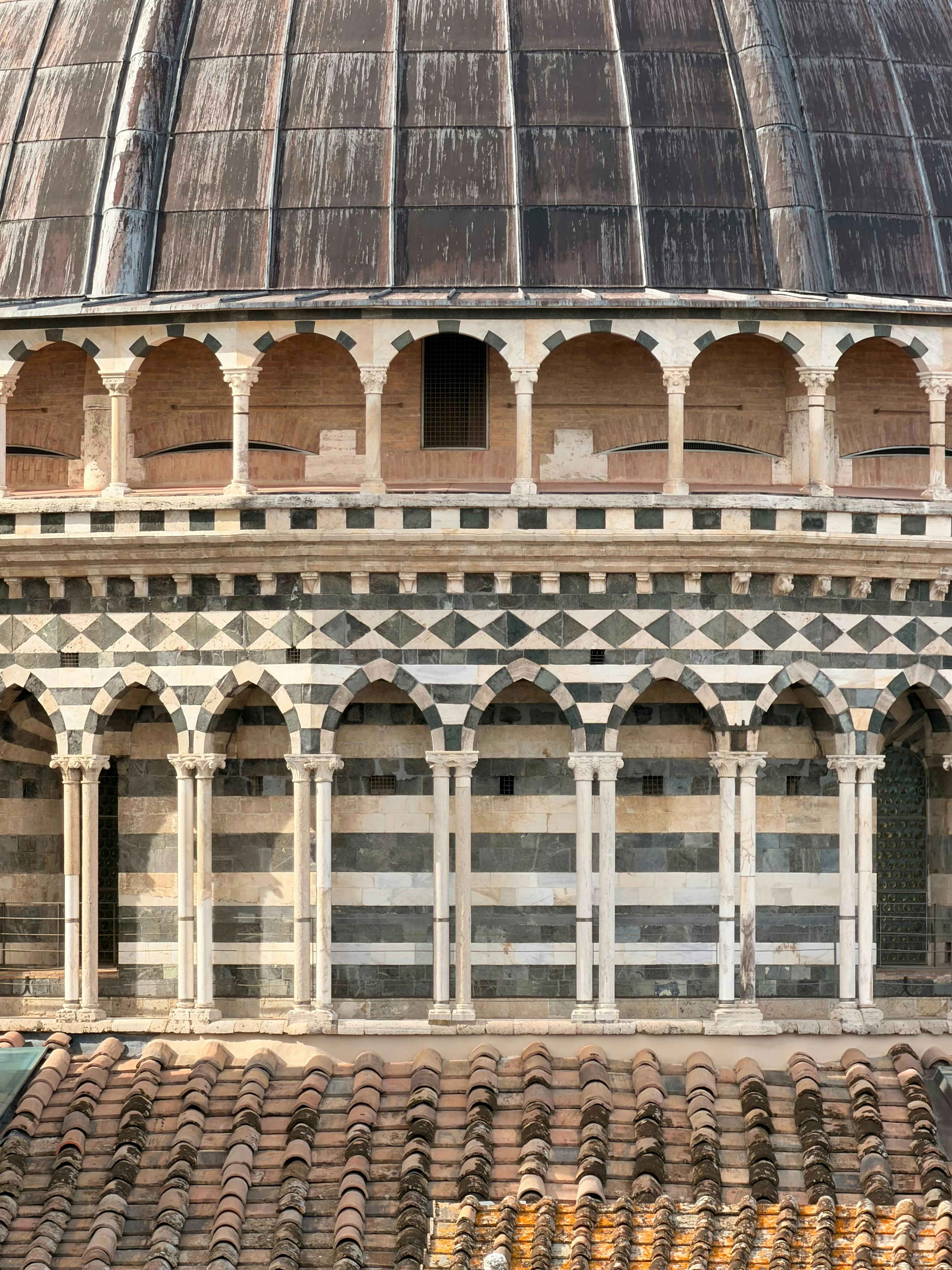 Architectural detail of a domed building with arches.
