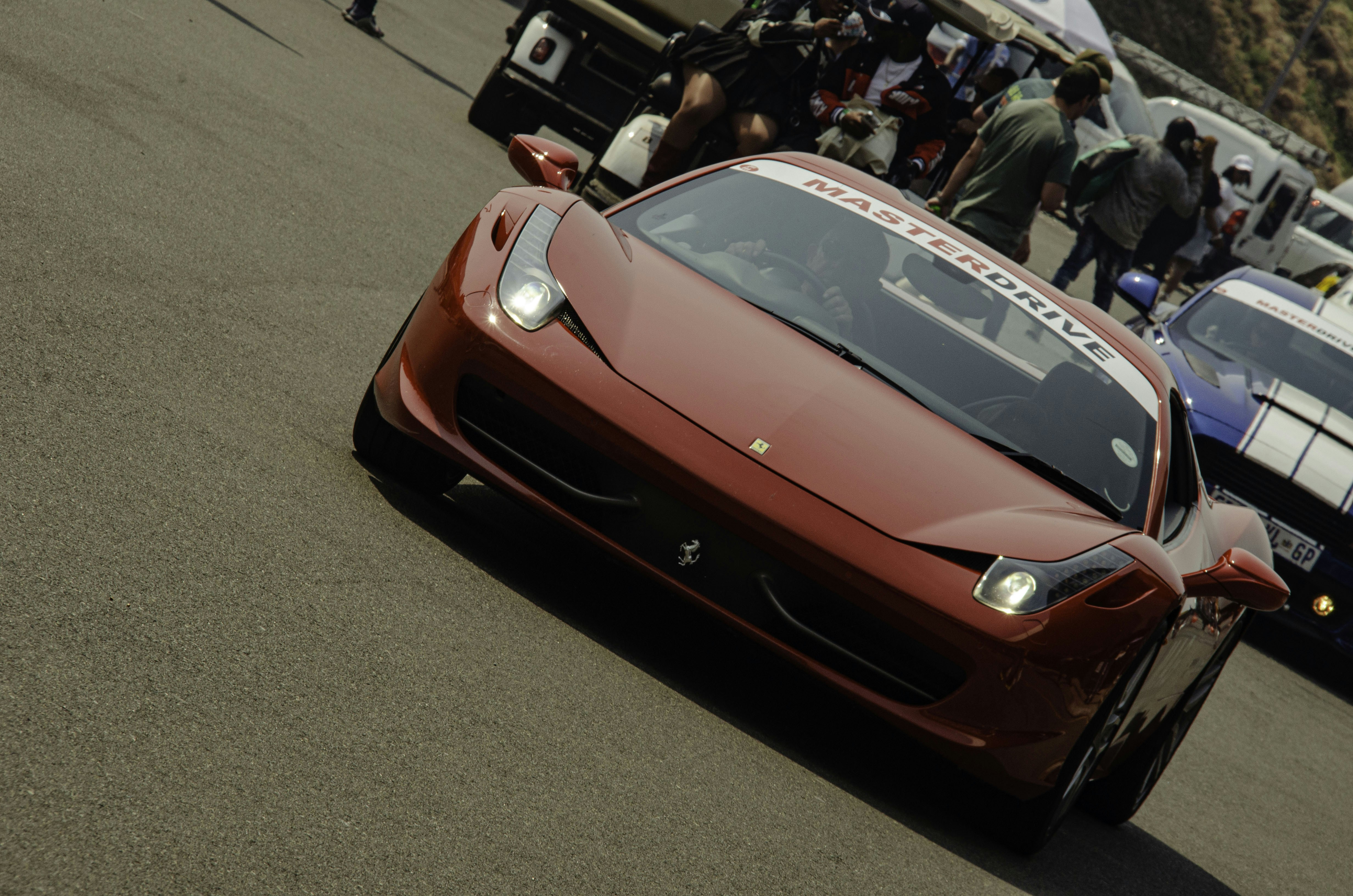 A red sports car on a race track.