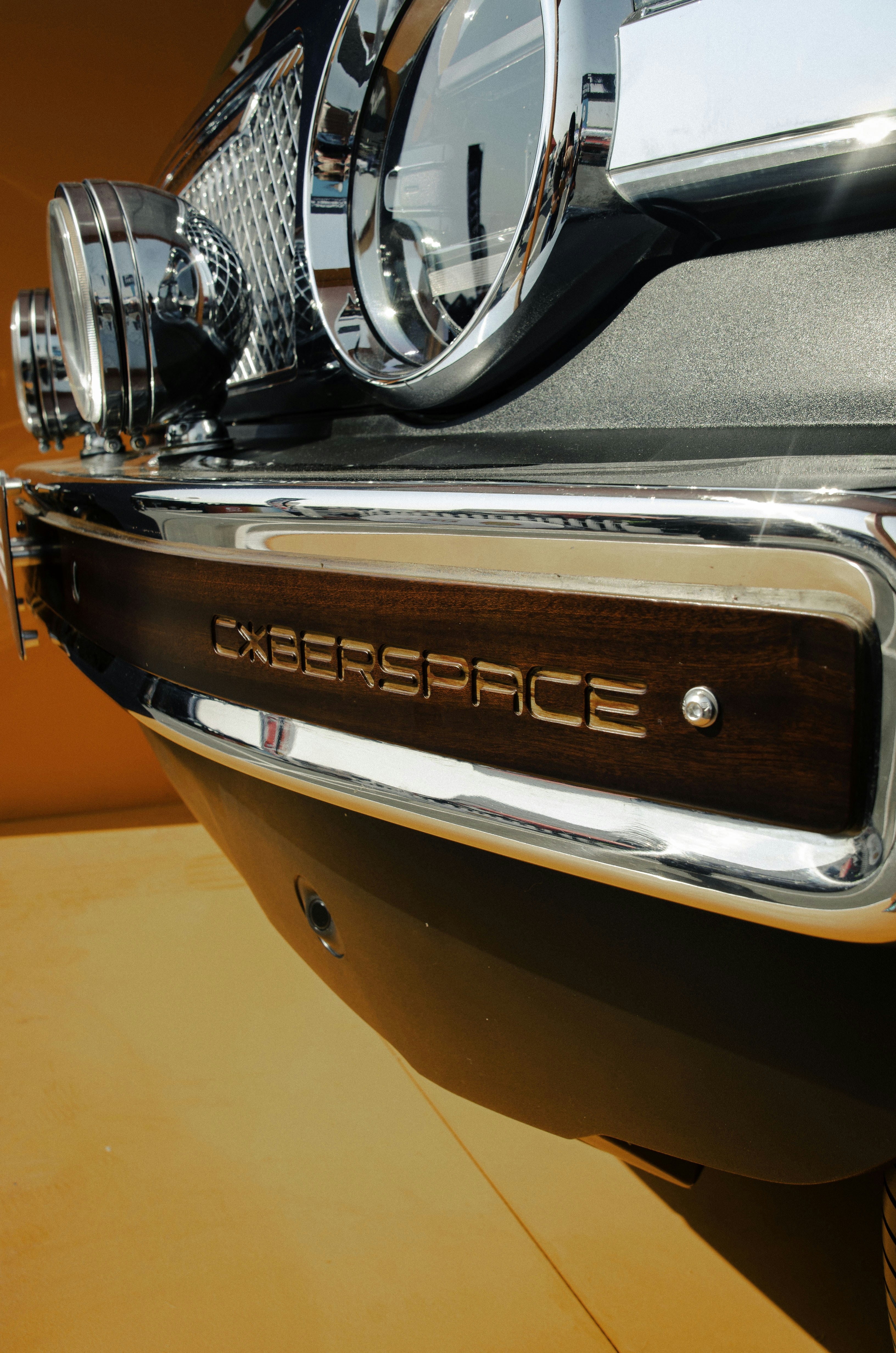 Close-up of a vintage car's wooden grille