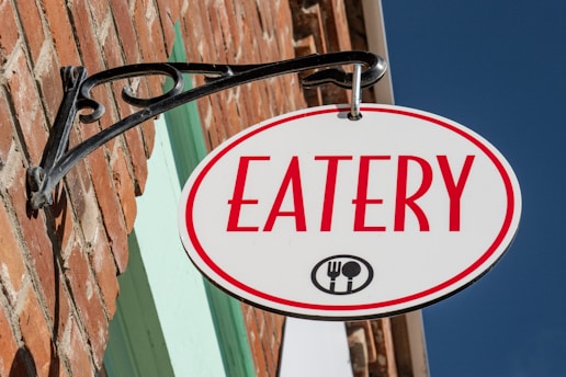 Eatery sign on a brick building