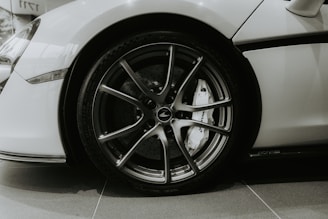 Close-up of a white sports car wheel and tire.