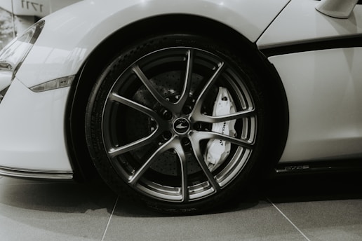 Close-up of a white sports car wheel and tire.