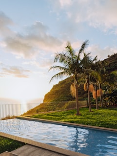 Swimming pool overlooking the ocean at sunset.