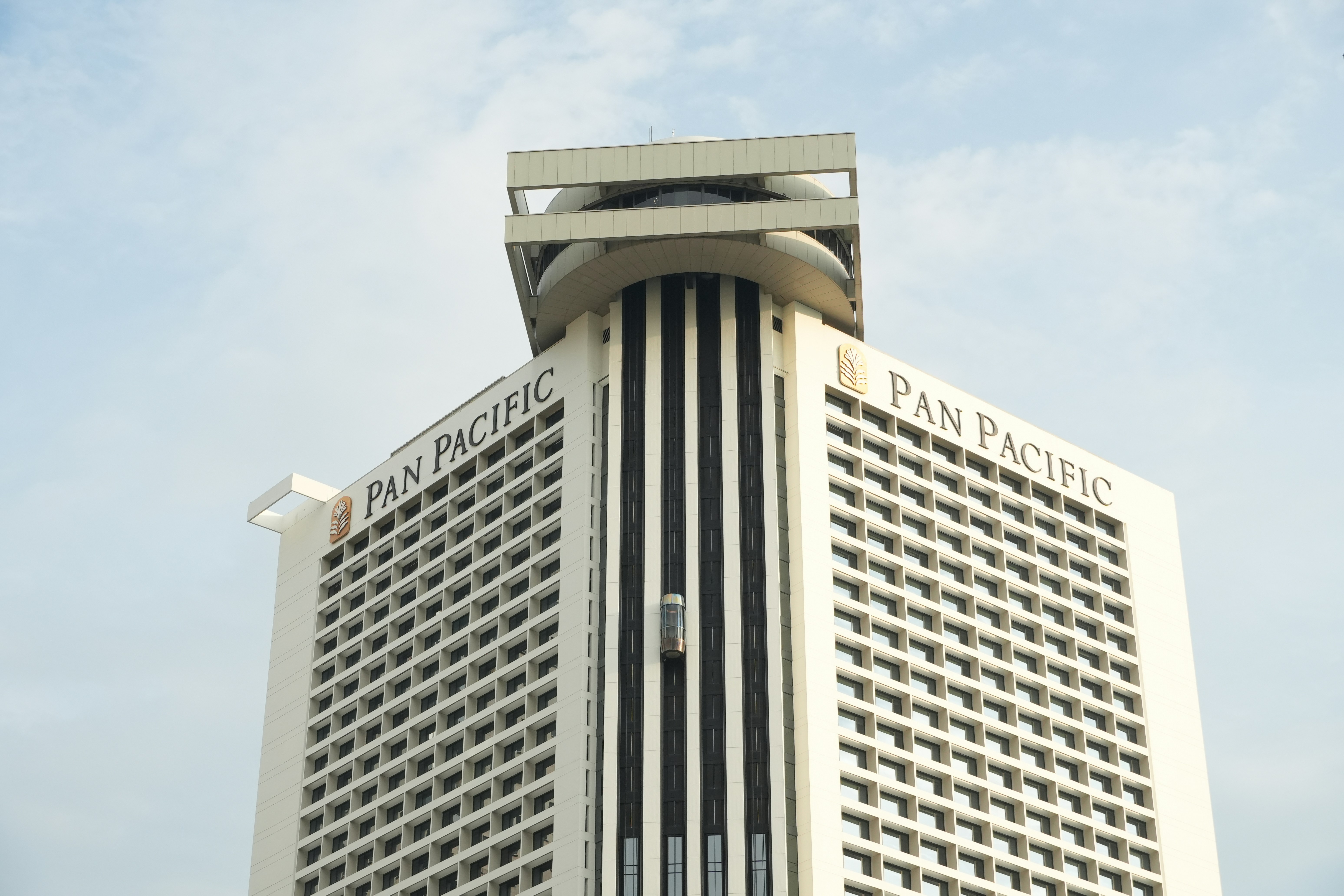 Pan pacific building against a cloudy sky