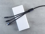 White power bank with three charging cables