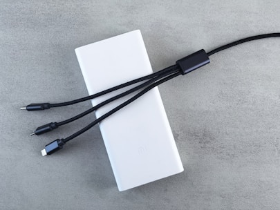 White power bank with three charging cables
