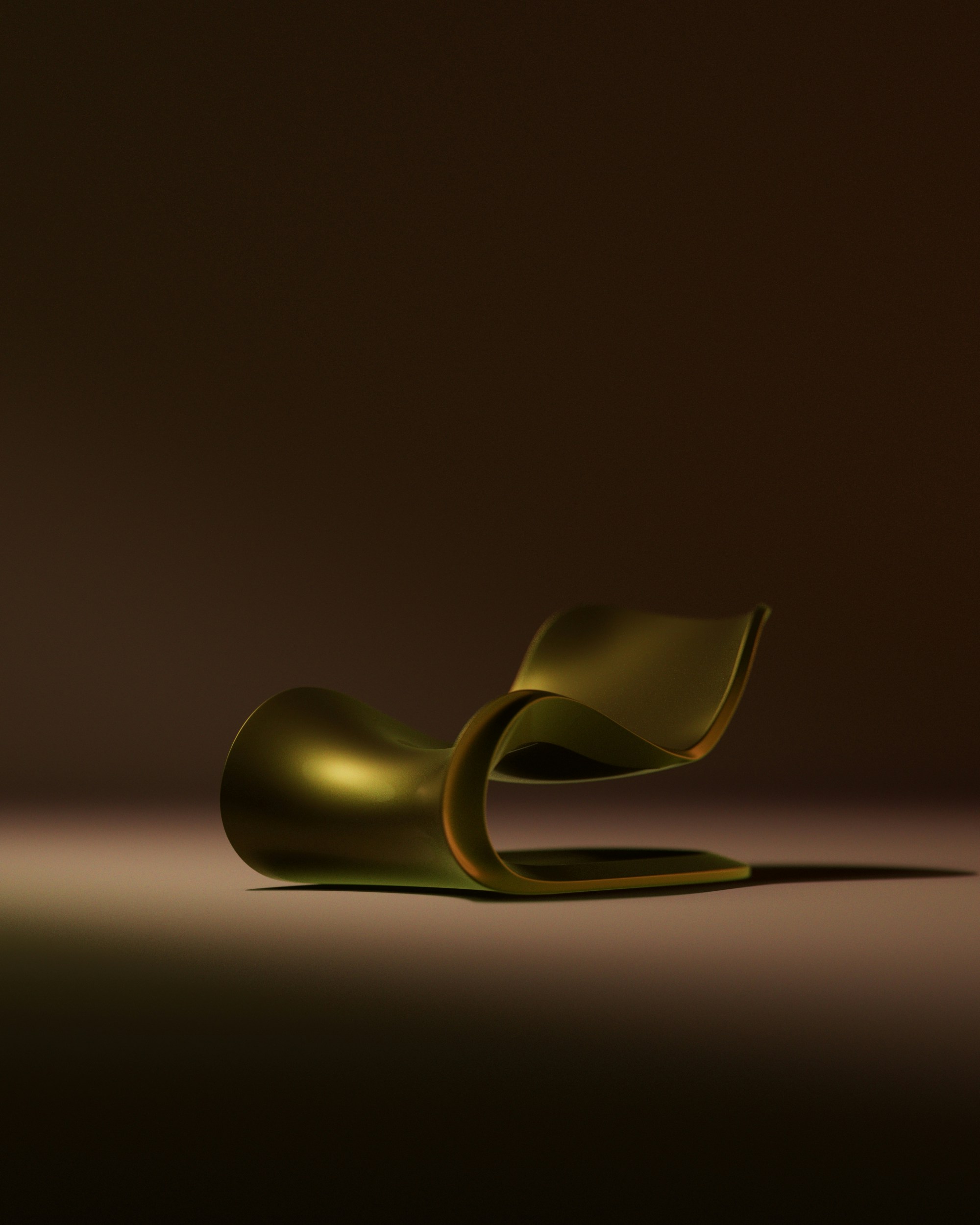 A sleek, golden chaise lounge on a dark background