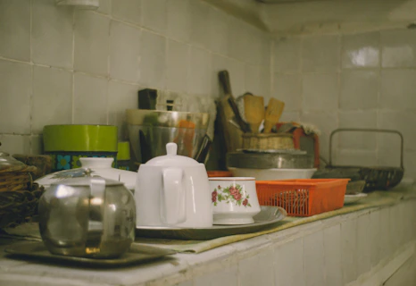 Various kitchenware items arranged on a shelf.
