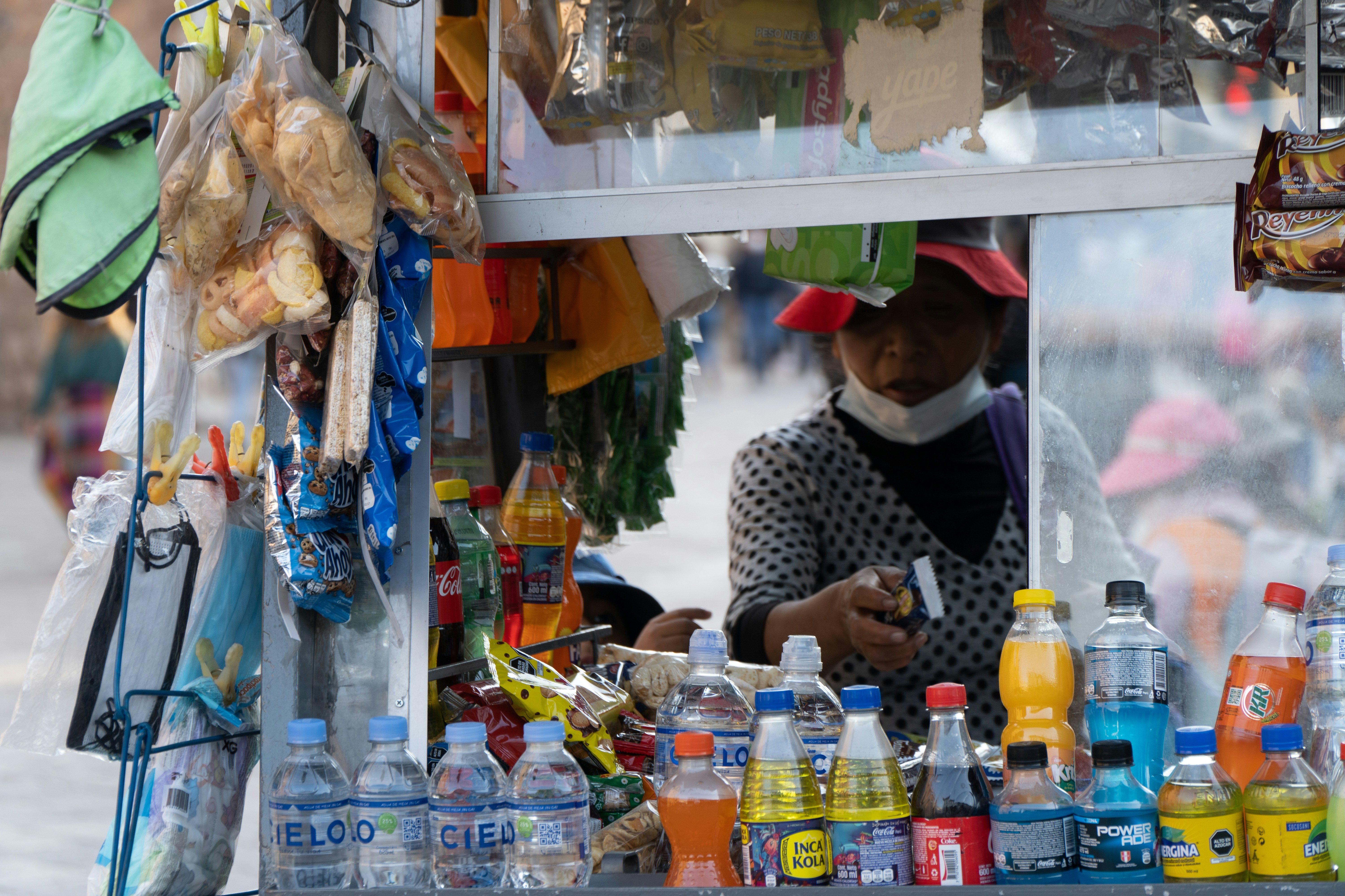 Street vendor with drinks and snacks for sale