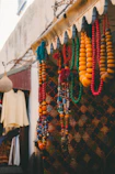 Colorful beaded necklaces hanging outside a shop