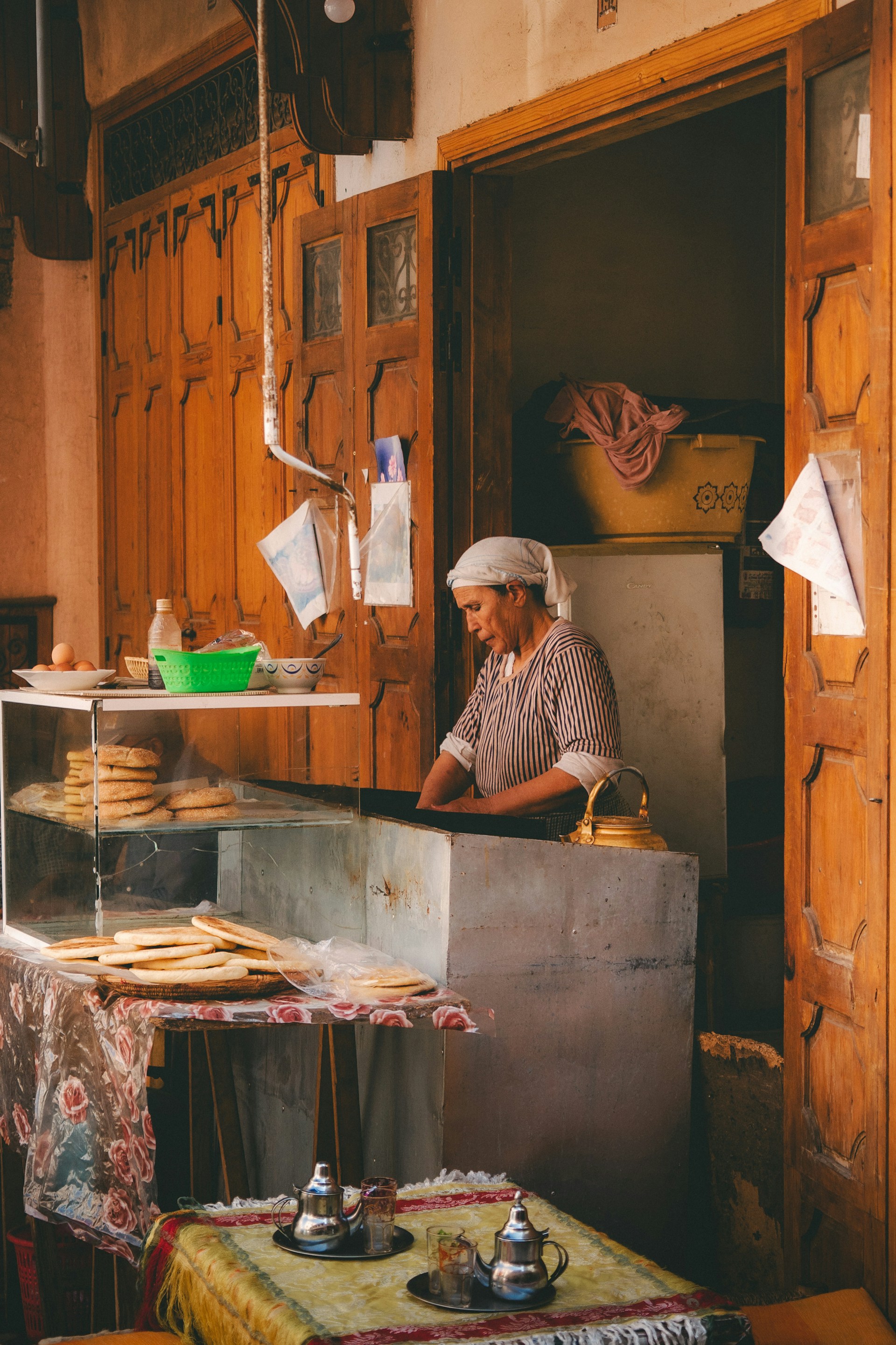 Woman working in a traditional bakery preparing food