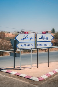 Road signs point to marrakech and ouarzazate
