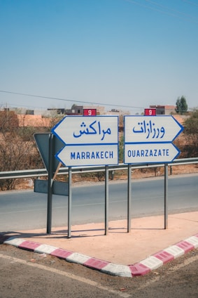 Road signs point to marrakech and ouarzazate