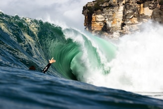 Surfer inside a large, powerful ocean wave.