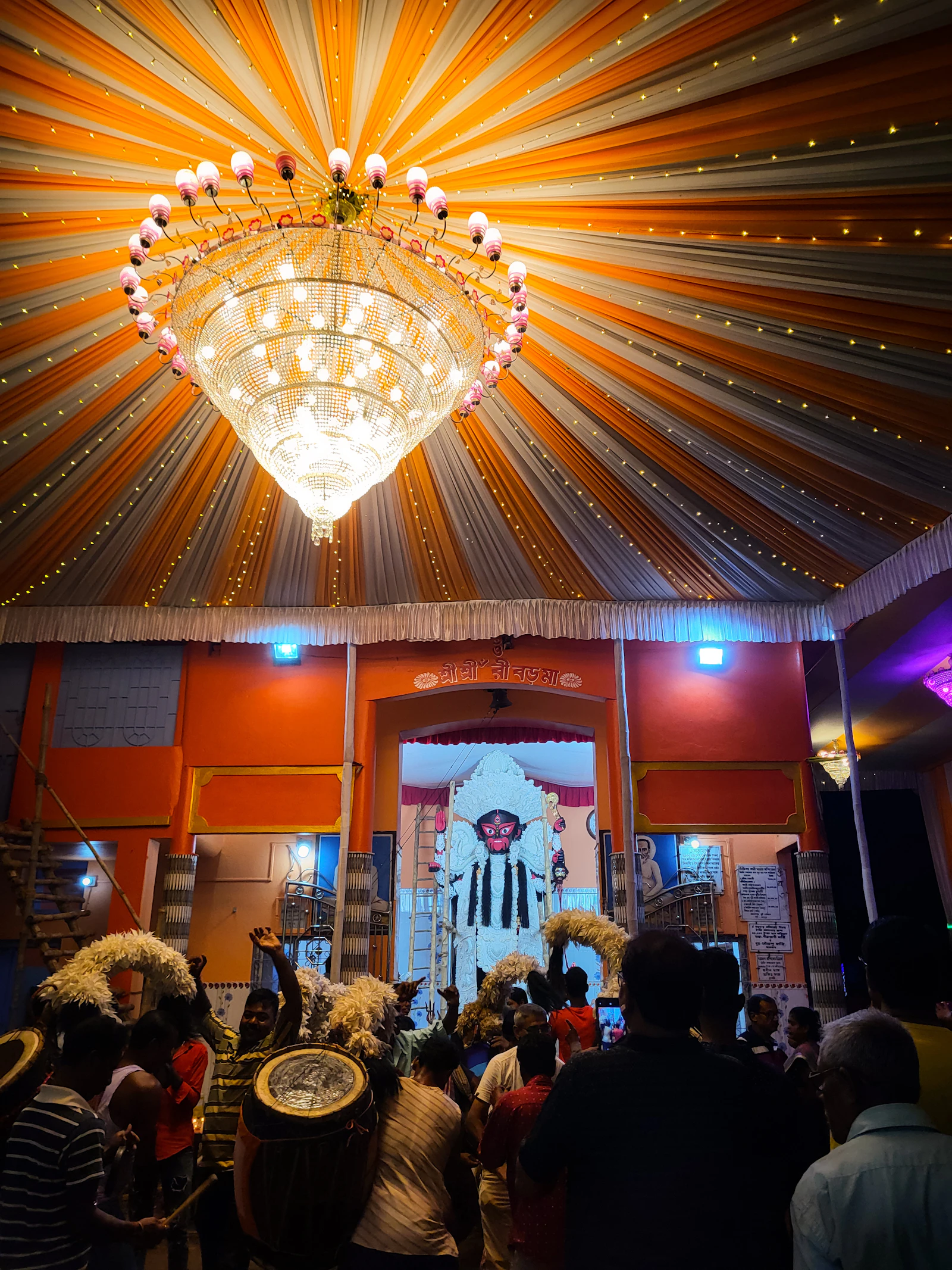 Guests under a grand chandelier