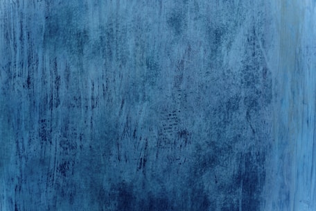 Textured blue abstract background with vertical streaks