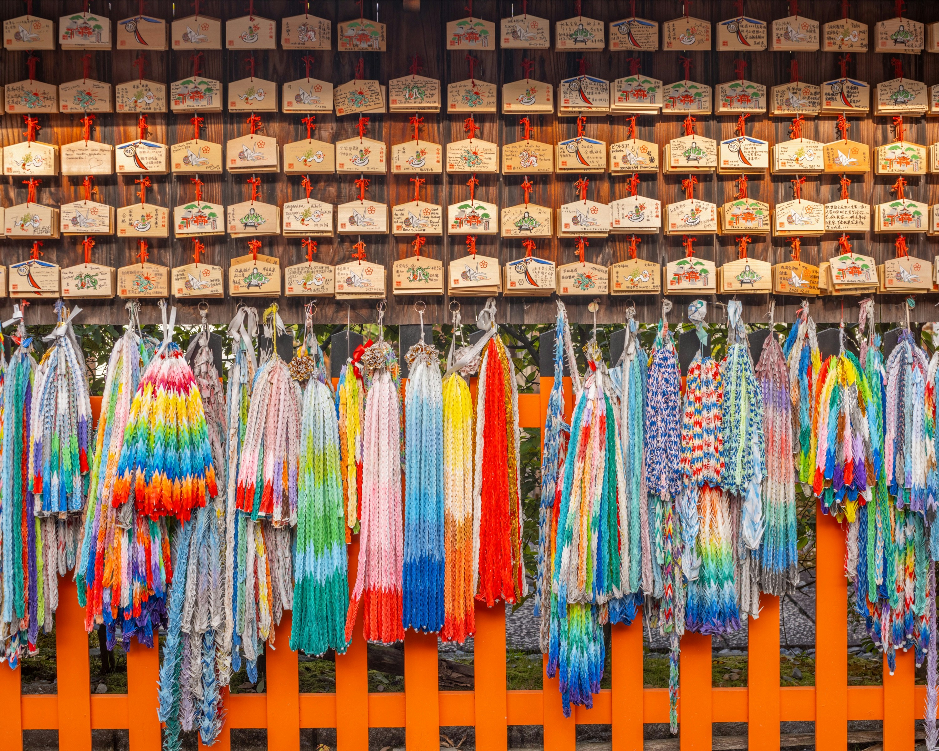 Rack of colourful waterproof jackets and pants in a Montbell store