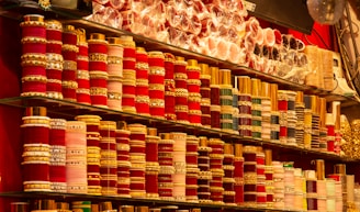 Rows of colorful bangles and bracelets displayed on shelves.