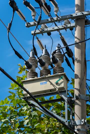 Electrical transformer mounted on a utility pole.