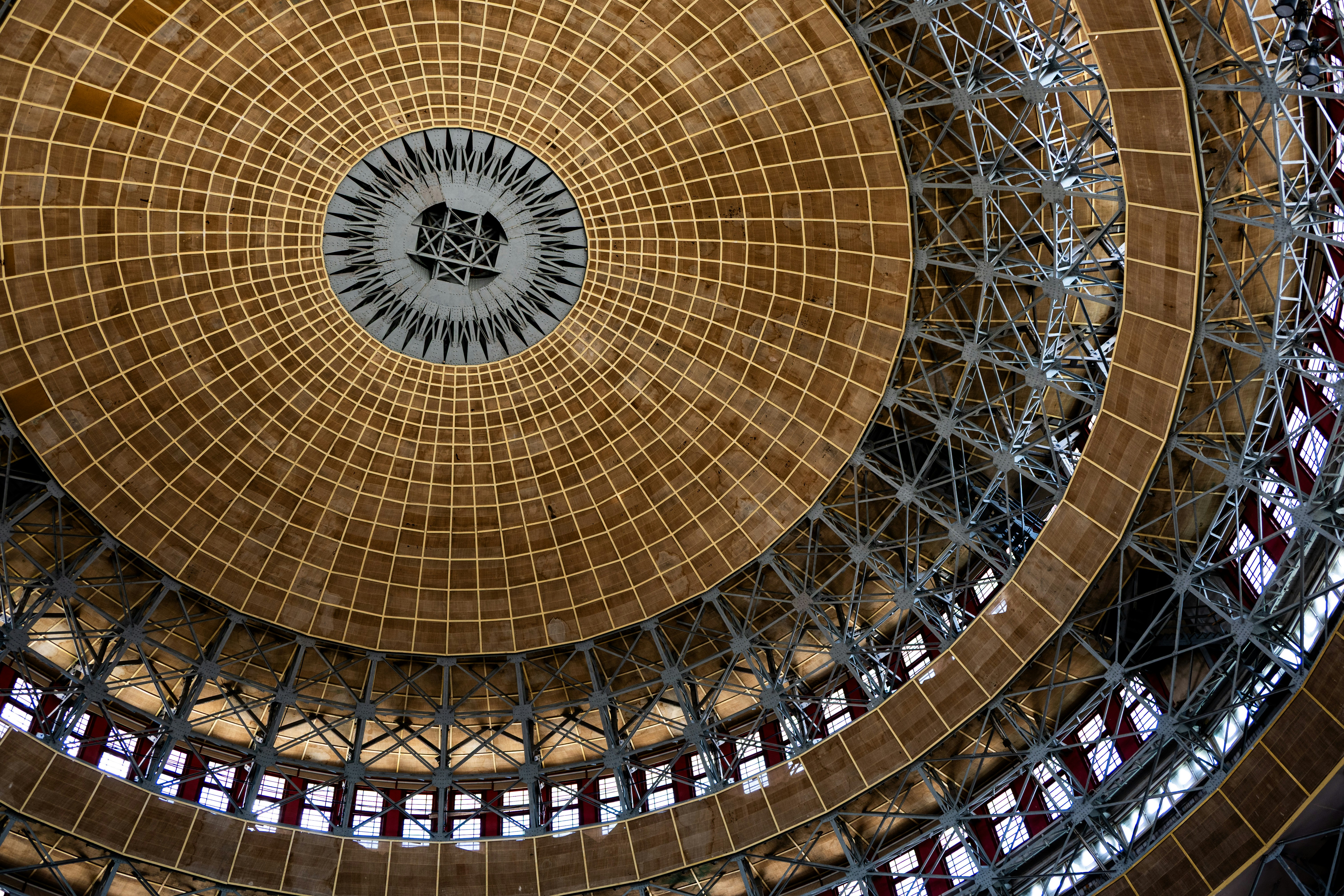 Intricate wooden dome ceiling with metal supports