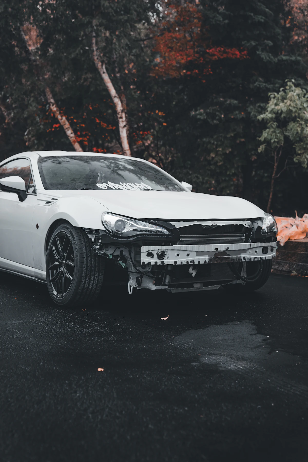 Car with the front bumper removed, brackets exposed