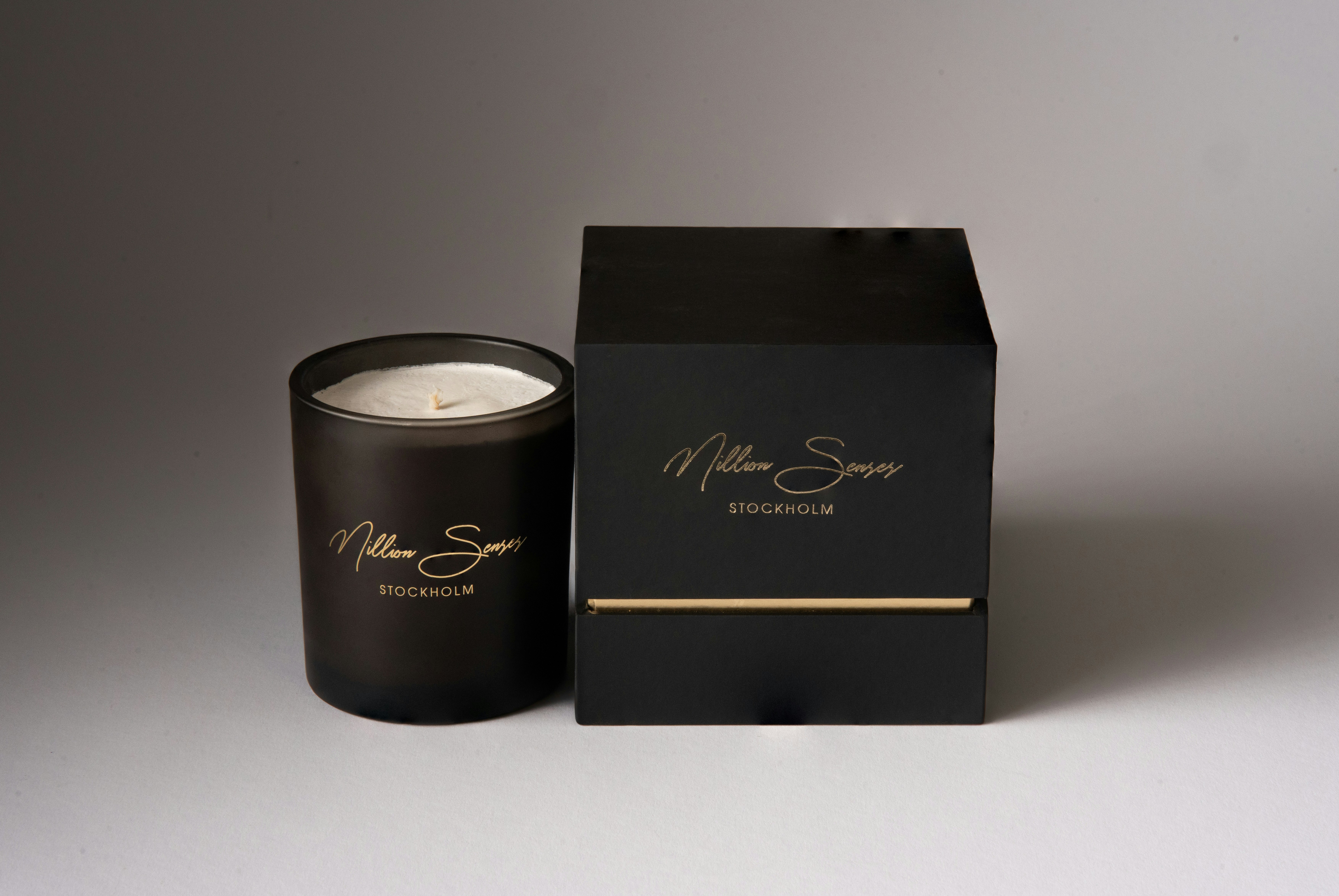 A black candle and its matching box