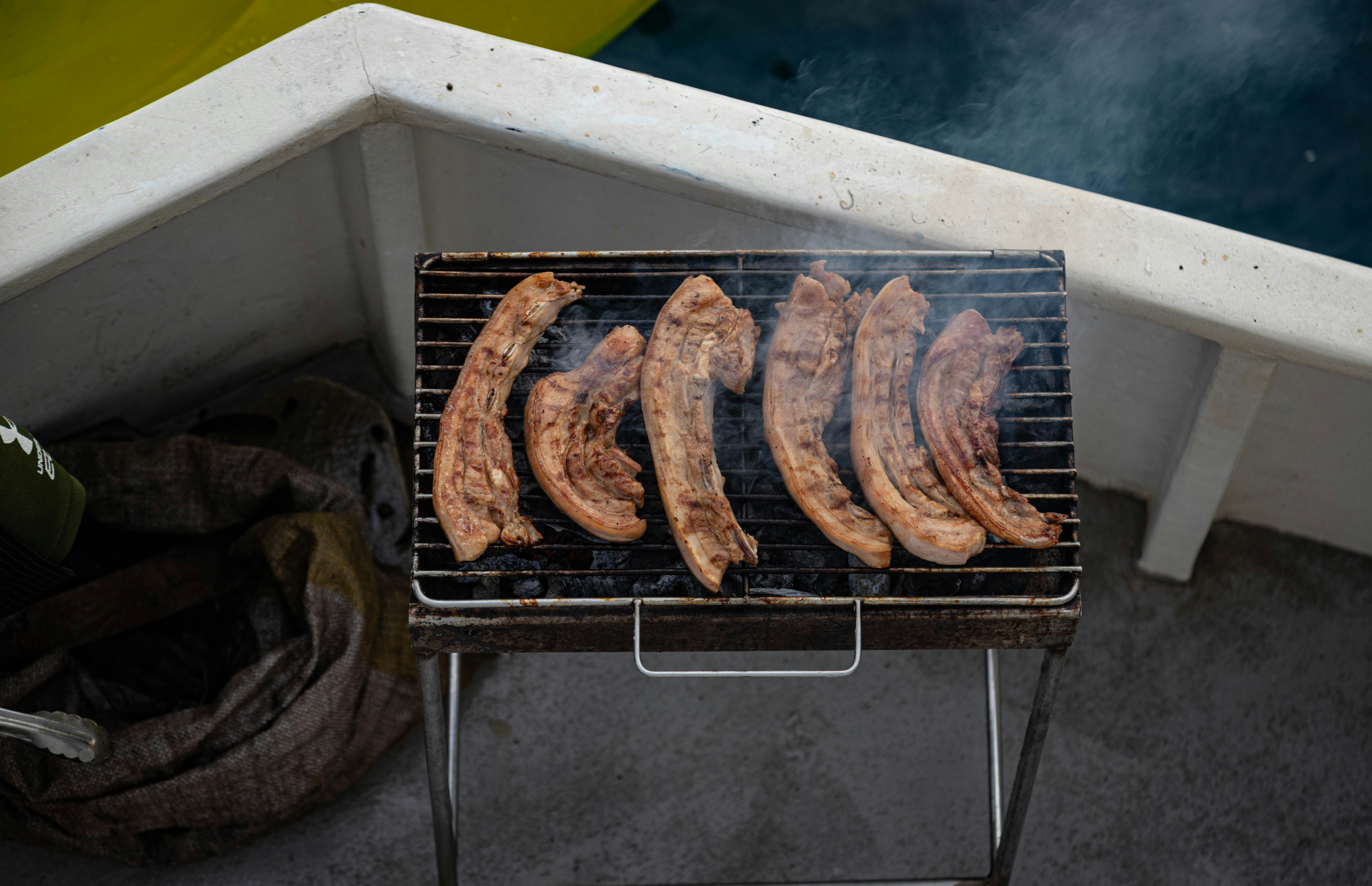 Bacon sizzling on grill