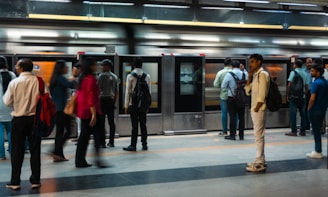 People waiting for a train at a subway station.