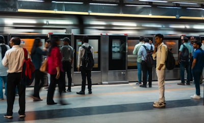 People waiting for a train at a subway station.