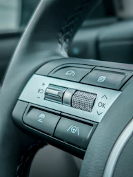 Close-up of a modern car steering wheel controls.