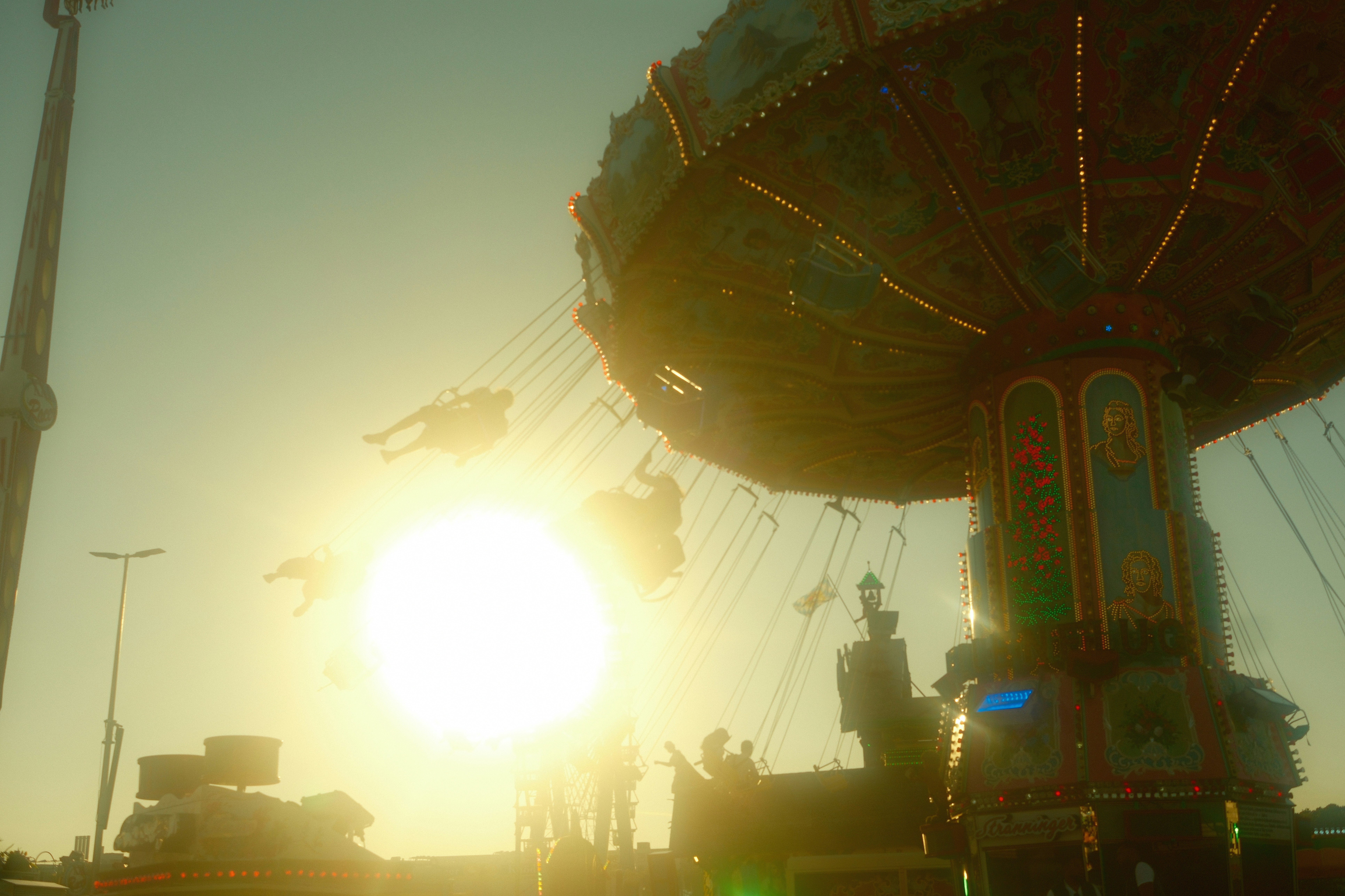 Swing ride at a carnival during sunset