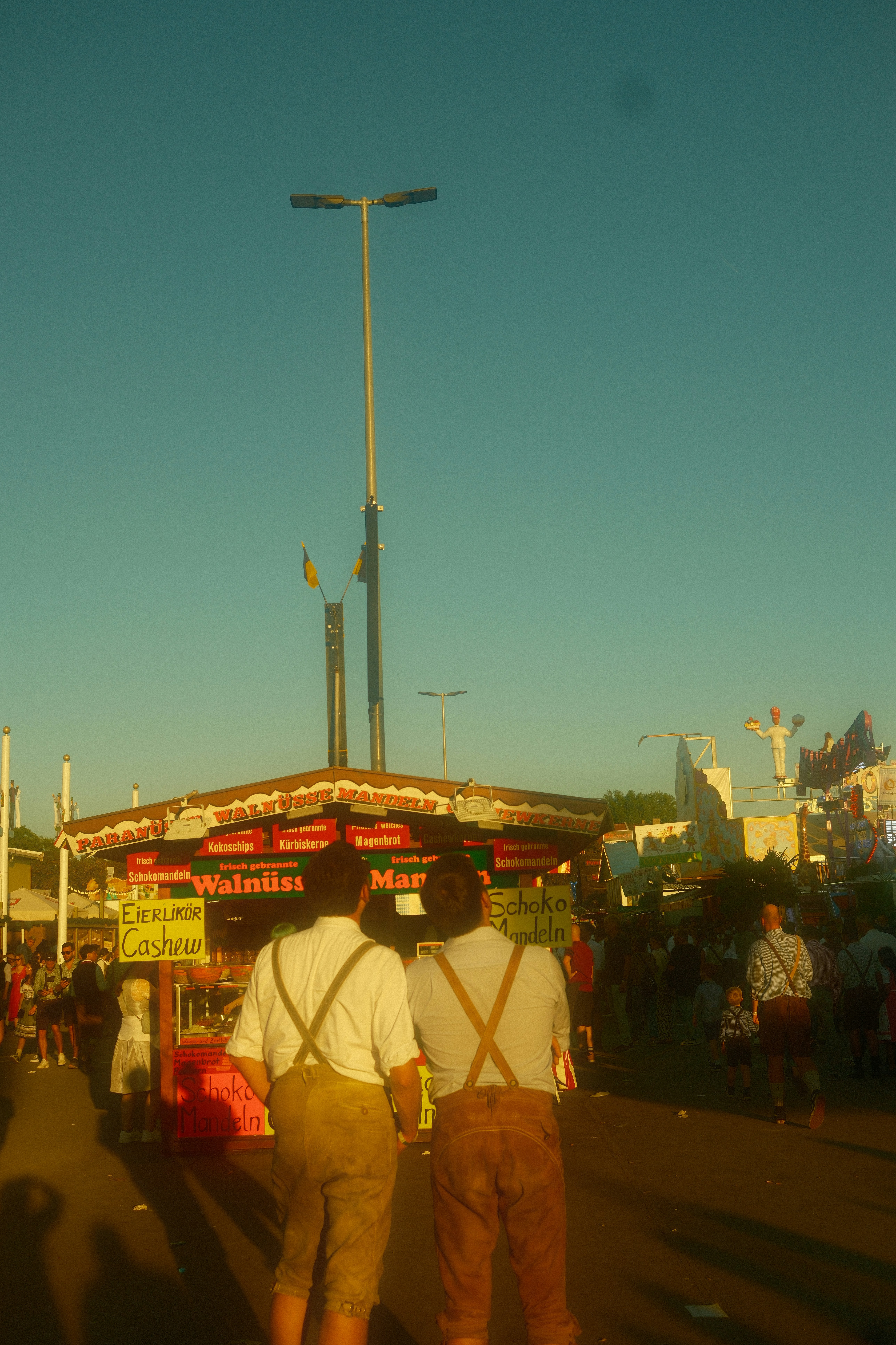 Two men in lederhosen at a festival