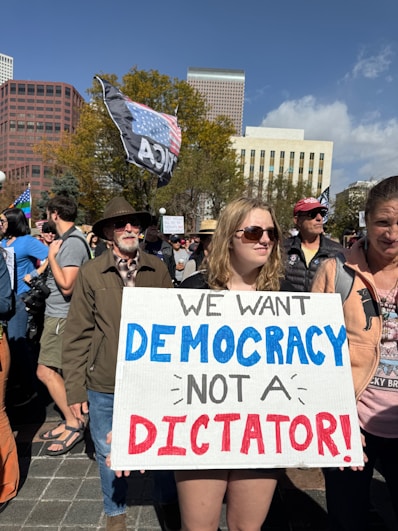 People protest "we want democracy not a dictator!"