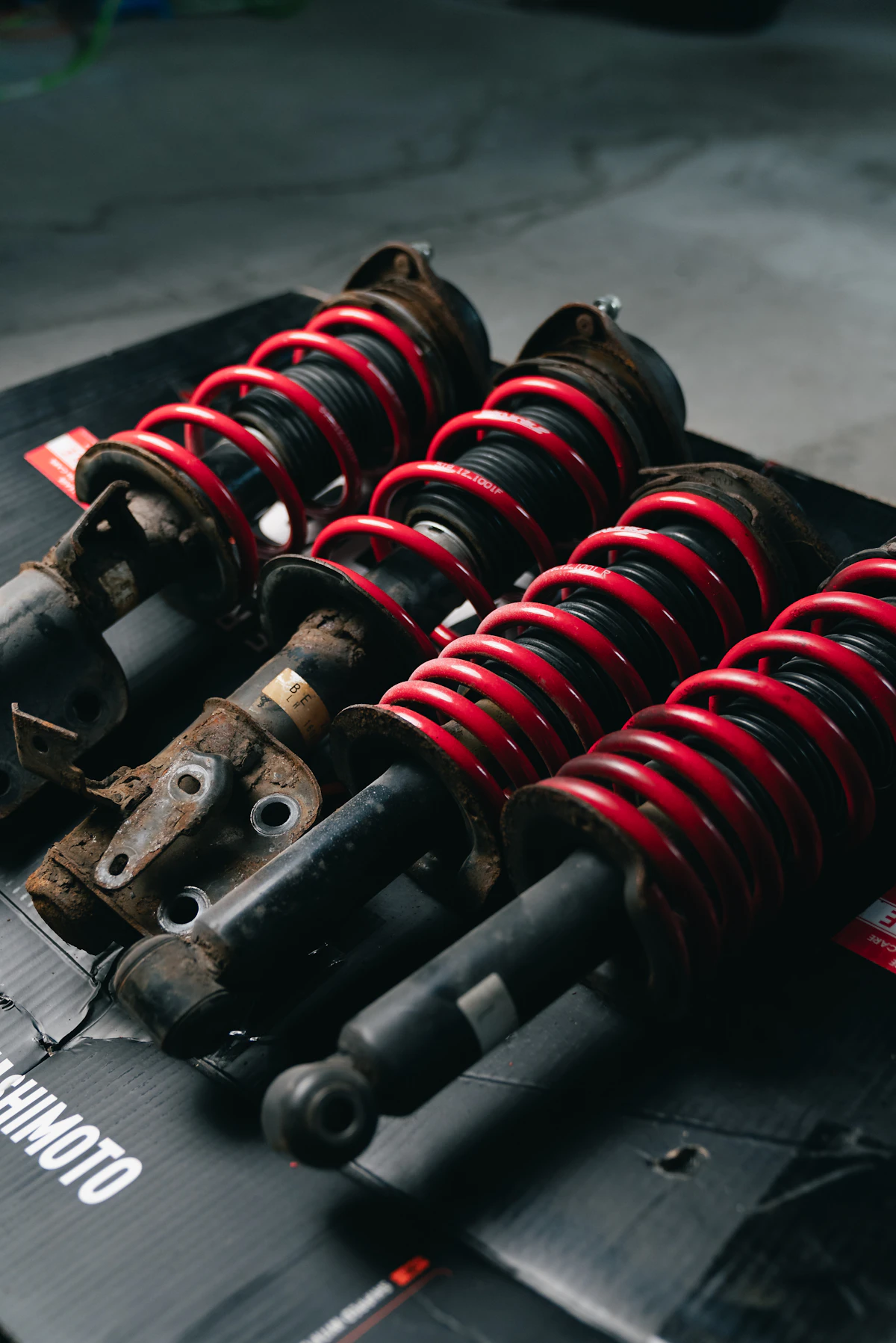 Set of red-spring coilover suspension assemblies