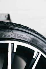 Close-up of a car tire with size information.