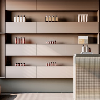 Shelves with skincare products and bottles in a salon.