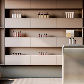 Shelves with skincare products and bottles in a salon.
