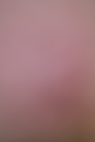 A soft pink and brown gradient background