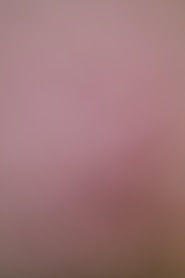 A soft pink and brown gradient background