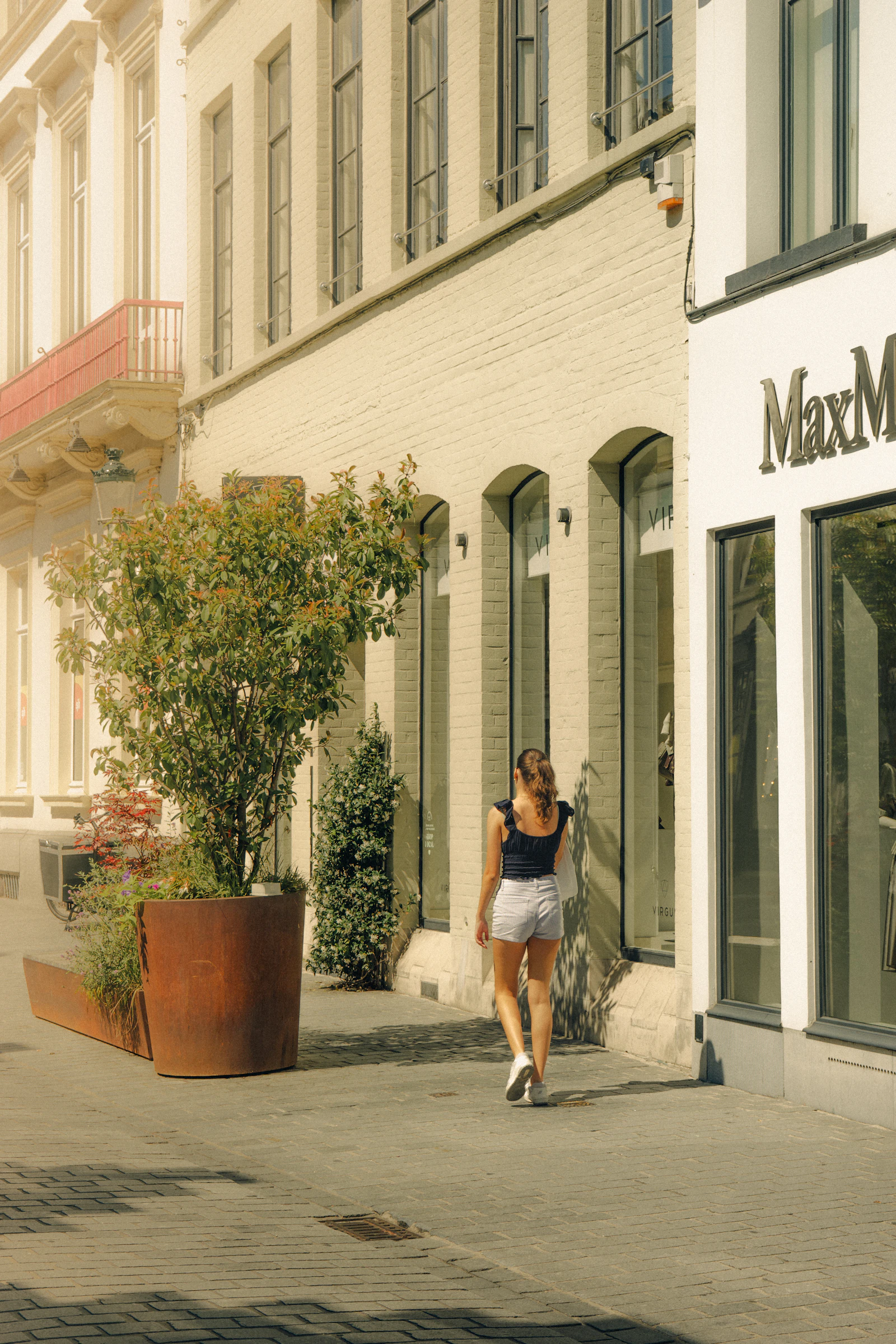 Traveller walking through a sunny European city in summer