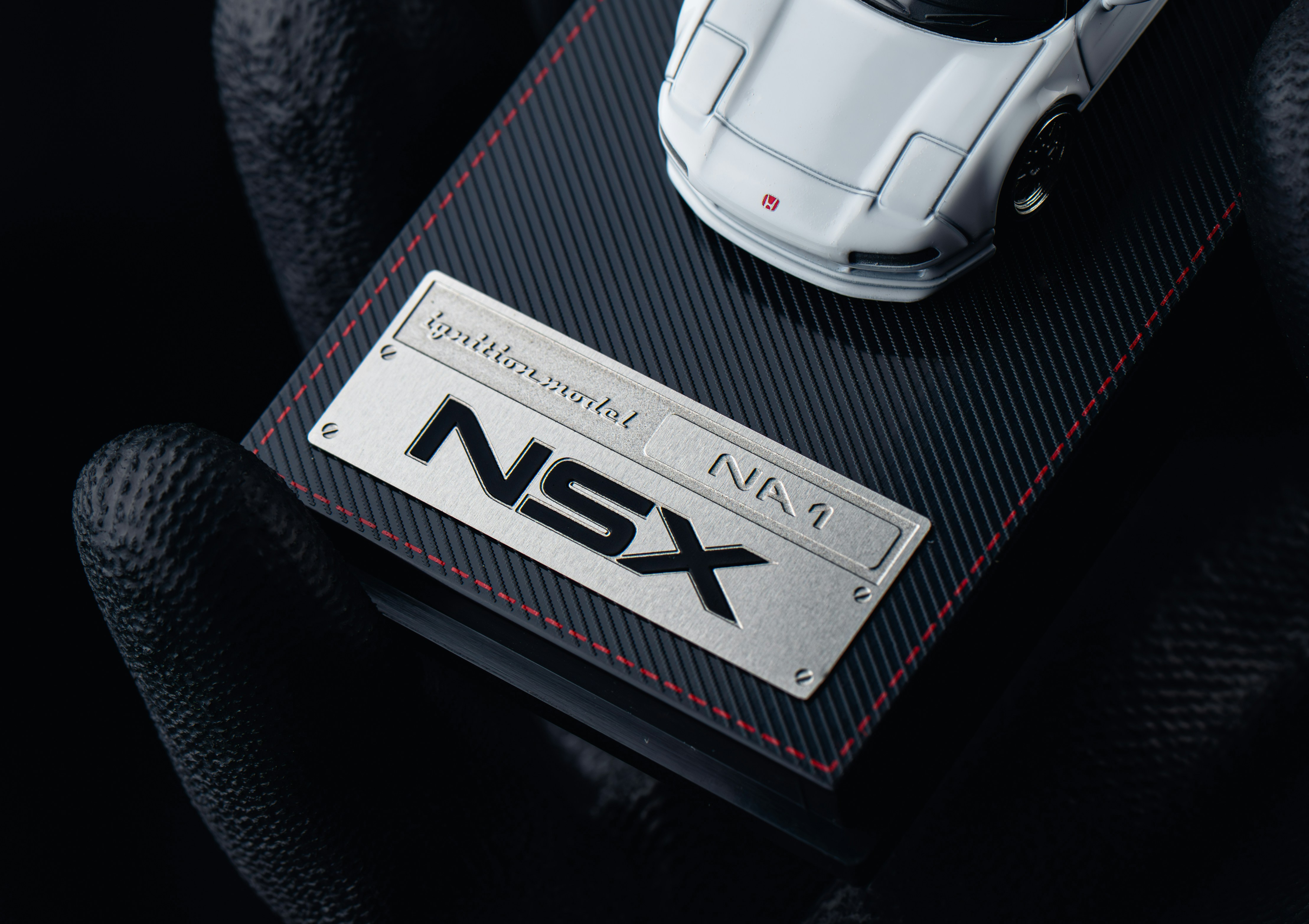 White nsx model car on display stand