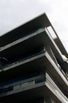 Modern concrete building with sharp geometric lines.